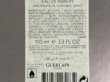 the label of a bottle of cologne on a metal surface