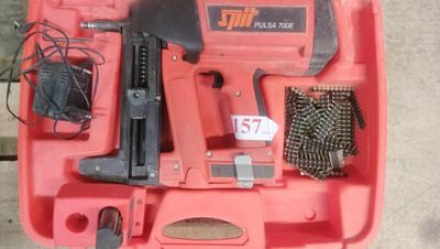 an image of a red tool box with a hammer, nail brush, and other tools