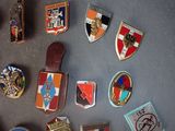 a lot of badges that are on a table