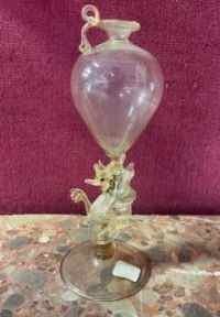a glass vase that is sitting on a table