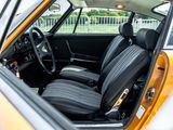 a yellow car with black leather seats in a parking lot