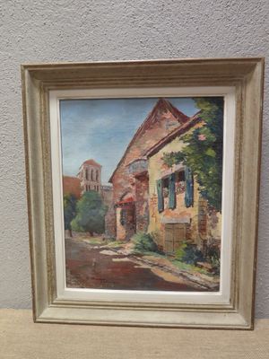 framed oil painting of a street scene with a church in the background