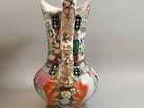 two vases that have been decorated with flowers on them