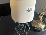 a lamp that is sitting on a table with a lamp on it