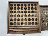 an old type of typewriter with a wooden box on it