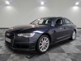 the audi s8 sedan is parked in a large room