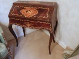 a small table with a drawer on top of it