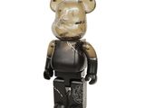 a bear that is standing up with a black shirt on
