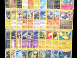 a lot of pokemon cards on the table together