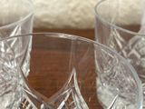 three glasses that are sitting on a table