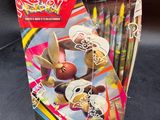 a box of pokemon trading cards on a table