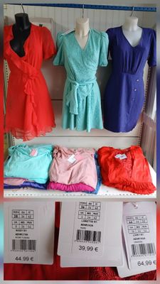 a display of dresses on a shelf in a store