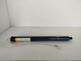 a close up of a pen on a white surface with a white background