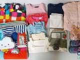 many items that are packed in a suitcase on the table
