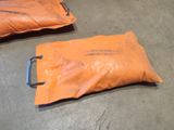 two bags that are sitting on the floor