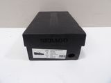 a close up of a black box on a white surface