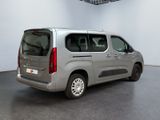 a silver van that is parked in a room
