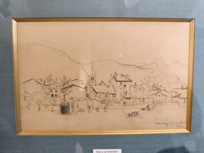un dessin représentant un village, exposé dans une vitrine