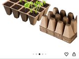an image of a bunch of cardboard boxes with plants in them