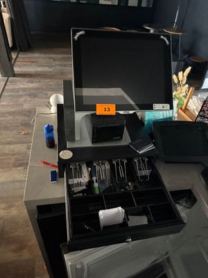 a laptop computer sitting on top of a glass desk