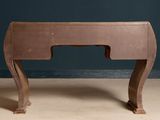 a small wooden desk with a small drawer on it