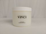 a white jar of hair mask sitting on top of a table