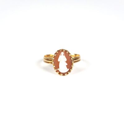 a gold ring with an oval cut stone in the center