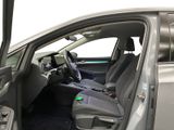 the interior of a car with the door open and the driver ' s seat down