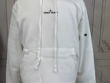 white hoodie on a mannequin stand with a white wall in the background