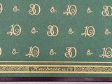 an image of a green and gold table runner with numbers