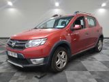 the red dacia is parked on a checkered tile floor