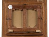 an old wooden picture frame with a tag hanging on it
