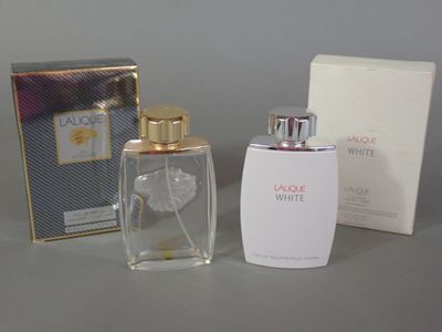 a bottle of perfume and a box of perfume on a table
