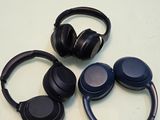 three headphones sitting on a table next to a pallet