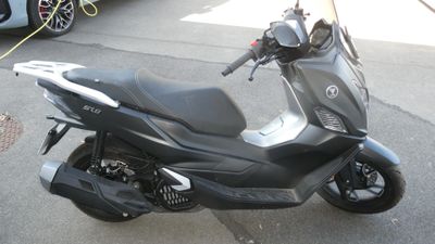 a motorcycle that is parked on the side of the street