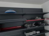 a shelf with many different items on it in a room