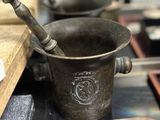 a mortar and a bowl sitting on a table