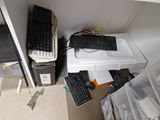 a computer desk with a keyboard and a mouse on top of it