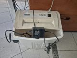 une photo d'une machine à laver dans une salle de bains