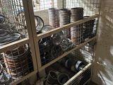 many pots and pans on the shelves in the room