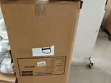 a cardboard box with a pile of clothes on top of it