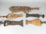 several different types of wooden handles and handles on a white surface