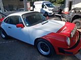 a white and red car parked in a parking lot