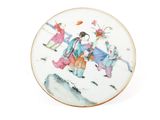 a plate with a picture of a woman riding a horse