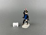 toy figurine of a man in a blue shirt and black pants holding a baseball bat