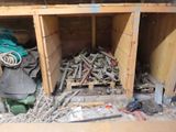 a pile of wood in the corner of a room