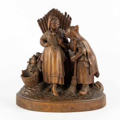 statue en bronze représentant deux femmes portant des paniers et un panier de fruits