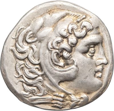 a silver coin with a woman ' s face on it