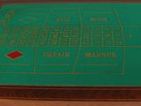 an image of a casino table with a green cloth on top of it