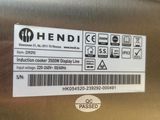 a sticker on the side of a stainless steel refrigerator